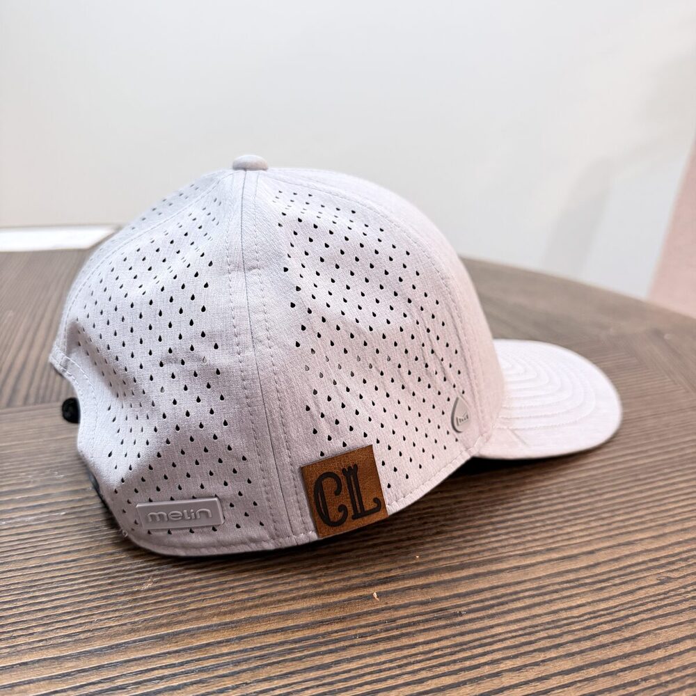 Close-up of a single custom trucker hat made at the bar