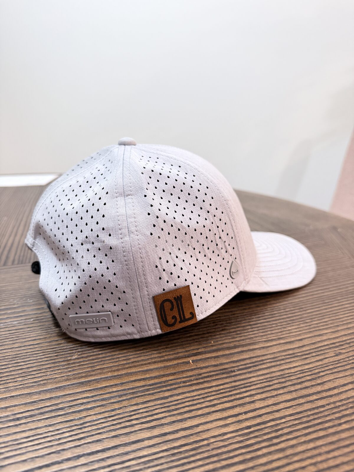 Finished custom leather-patch trucker cap made at a bachelorette hat bar